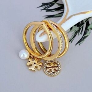 Tory Burch Elegant Gold-Tone Charm Ring Set